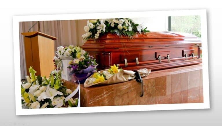 Flowers on top of a casket